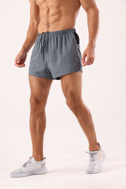 Entraînement athlétique Summer Running Sports Gym Cloths Men's Short avec poches